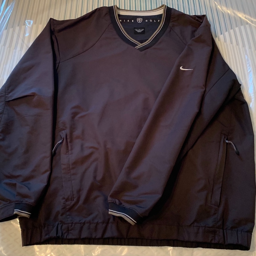 Men's size Medium Nike Golf V-neck wind shirt.